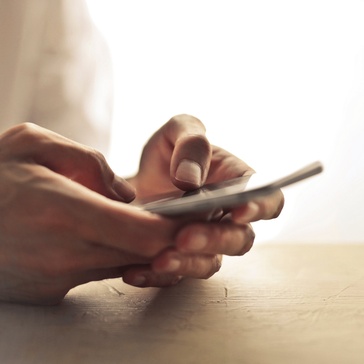 hiring-tips-for-employers-woman-talking-on-phone-taking-notes